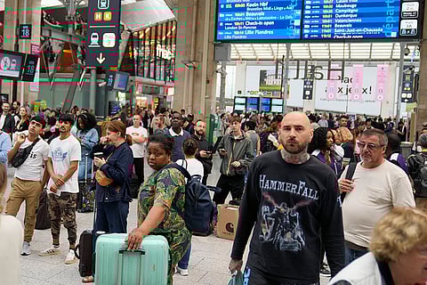 Travelers wait at Gare du Nord train station in Paris